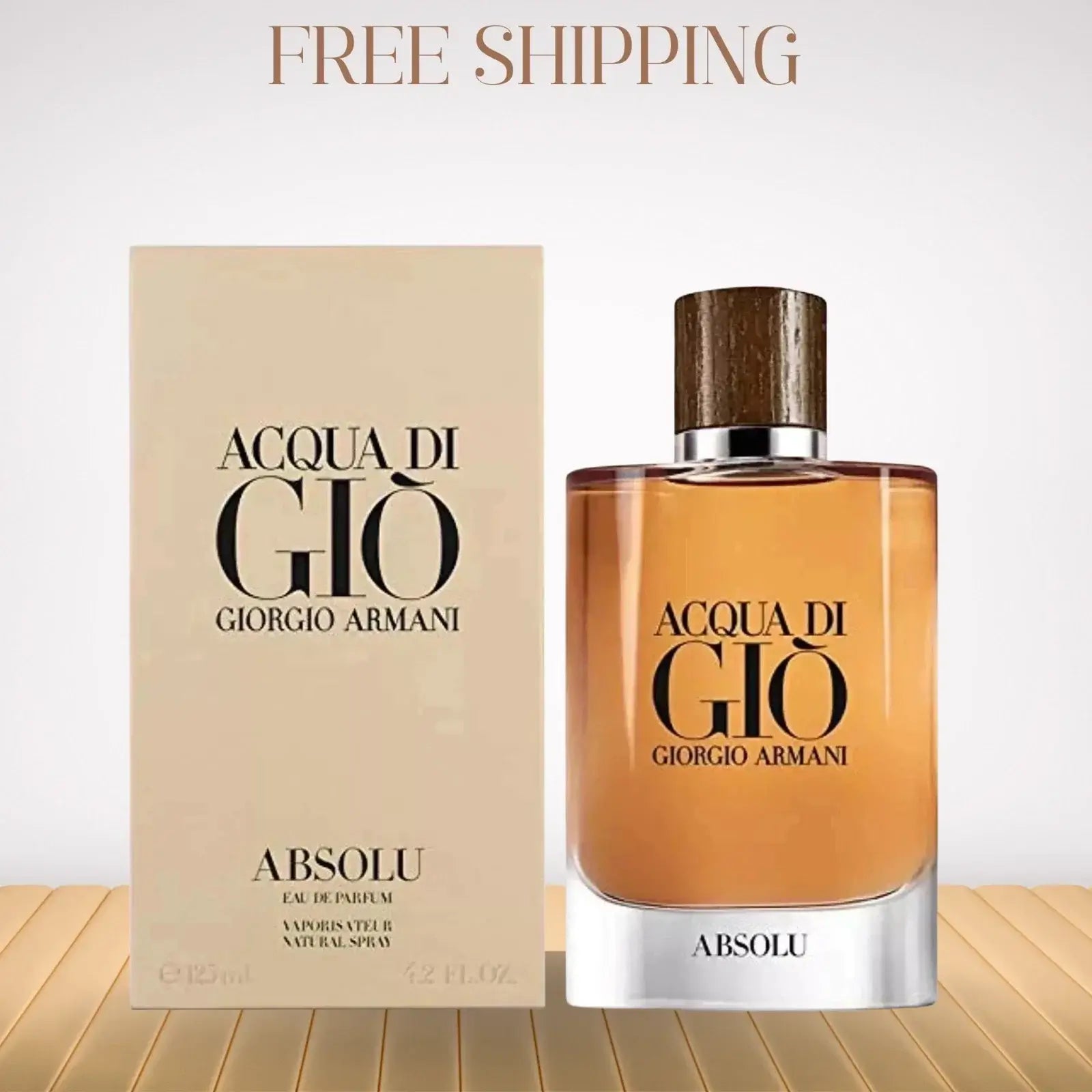 Acqua di Giò Absolu perfume bottle and packaging on a wooden surface with 'Free Shipping' text.