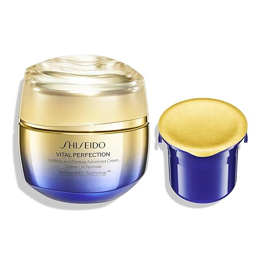Shiseido Vital Perfection cream jar with gold lid on a white background