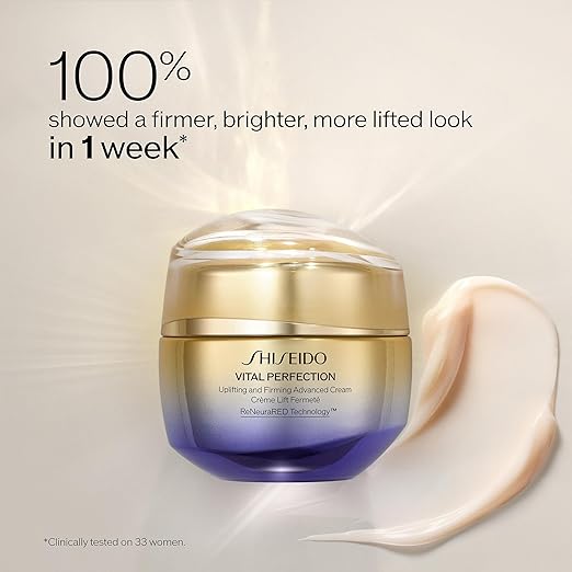 Shiseido Vital Perfection cream jar with cream swatch on a light background