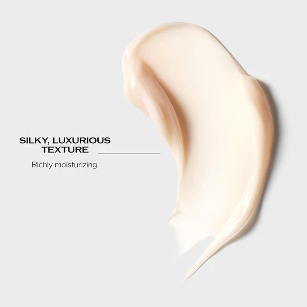 Silky, luxurious texture of a skincare product on a light gray background