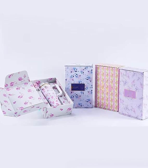 Set of floral-patterned boxes on a light gray background EA Supplements