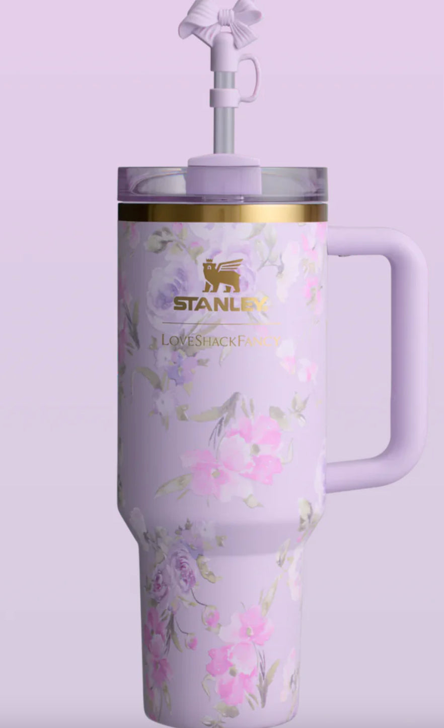 Floral-patterned water bottle with handle on a light purple background