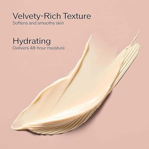 Velvety-rich texture cream smear with text on a pink background