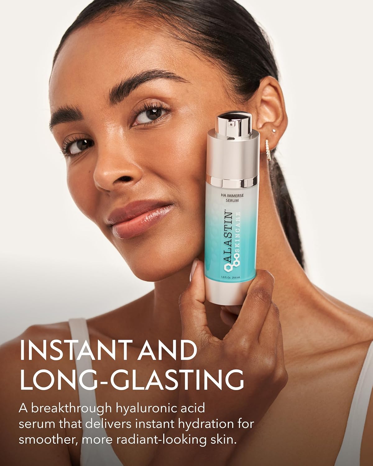 Woman holding a skincare serum bottle with text about instant and long-lasting hydration.